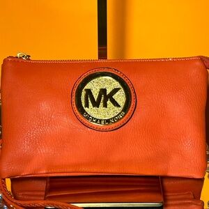 Michael Kors Tangerine Clutch with Gold Emblem
